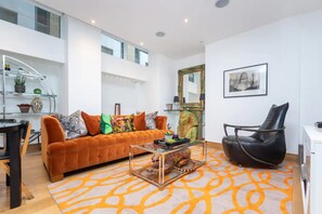 Basic Apartment, Multiple Beds | Living area | TV