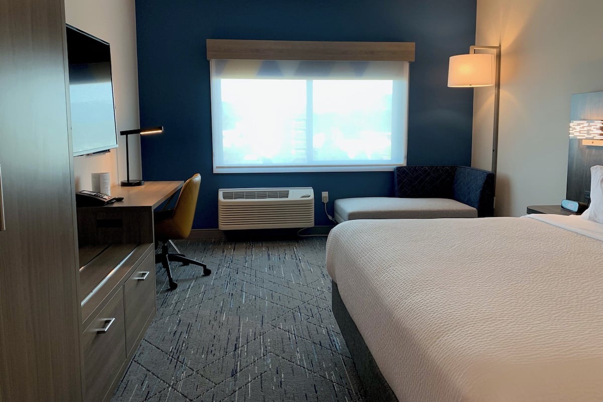 Desk, laptop workspace, blackout drapes, iron/ironing board