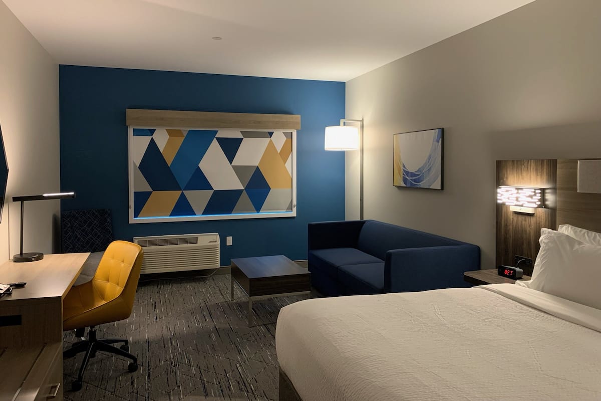 Desk, laptop workspace, blackout drapes, iron/ironing board