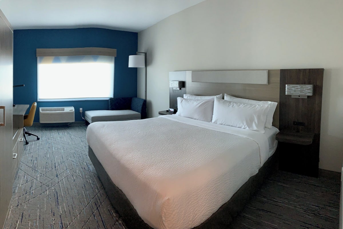 Desk, laptop workspace, blackout drapes, iron/ironing board