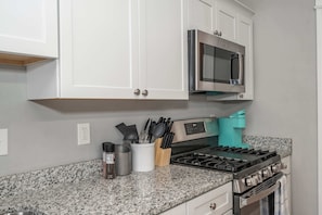 Condo, 2 Queen Beds, Kitchen, Garden View | Private kitchen | Fridge, microwave, oven, stovetop - Suites on Main 1 (Covington)