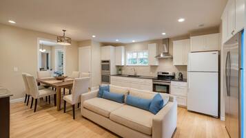 Standard Apartment, 5 Bedrooms | Living area | 55-inch Smart TV with digital channels, TV, Netflix