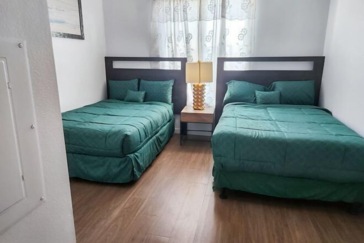 Premium bedding, memory foam beds, desk, laptop workspace