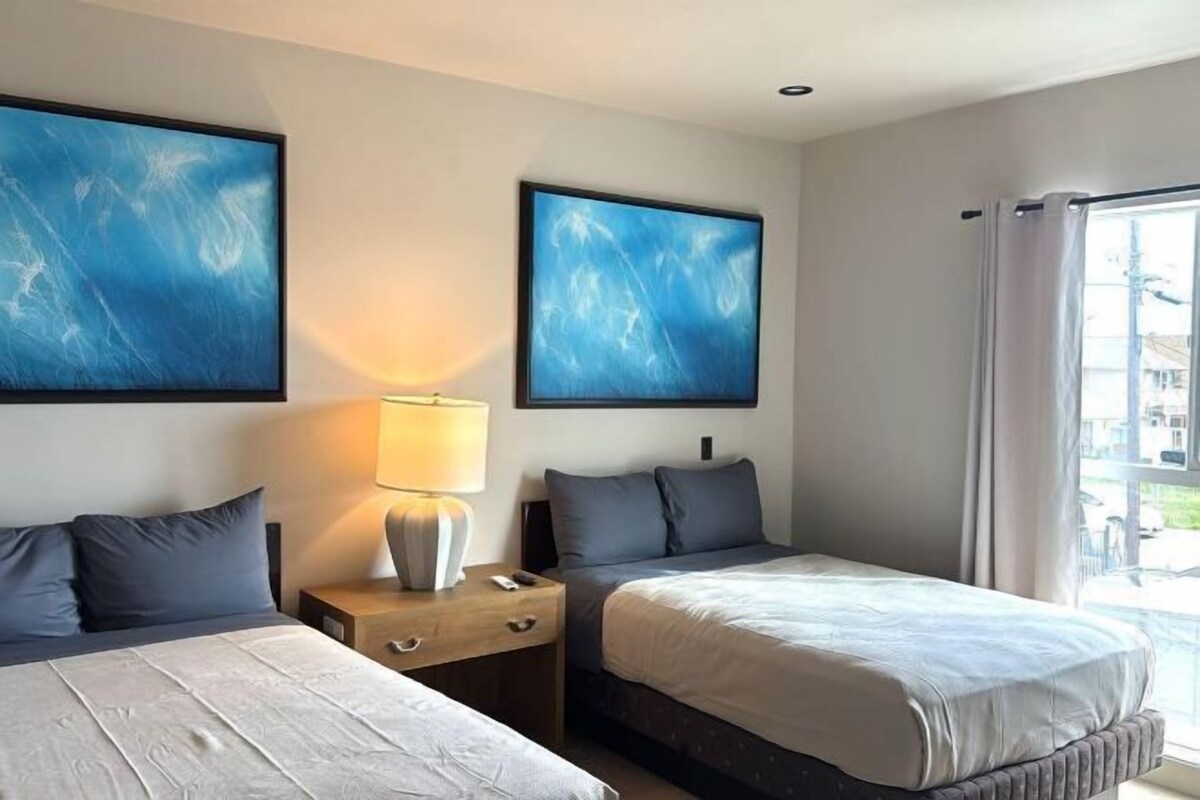 Premium bedding, memory foam beds, desk, laptop workspace