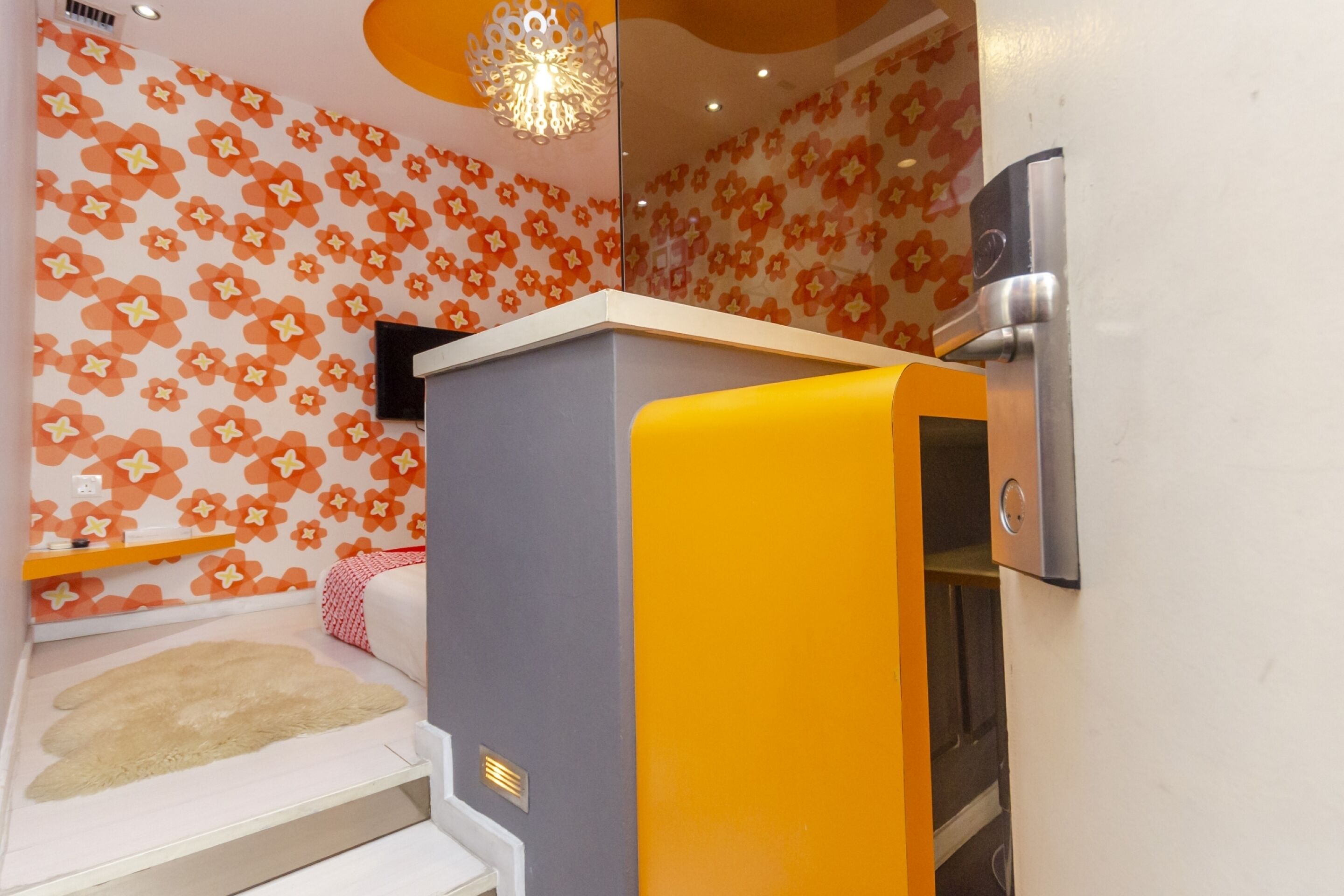 A bathroom with a shower, a toilet, and a sink.