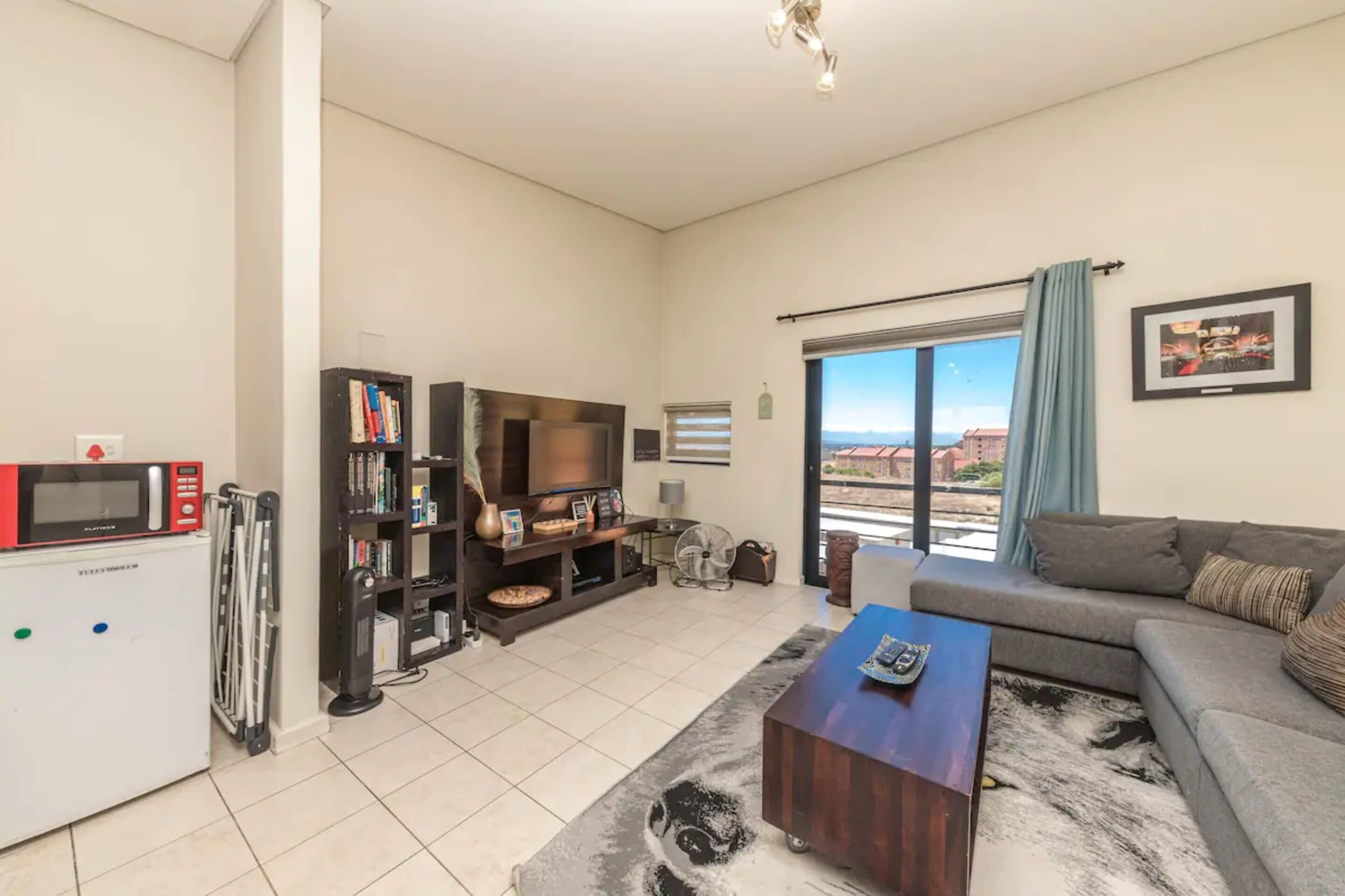 Basic Apartment, Multiple Beds | Living area | TV