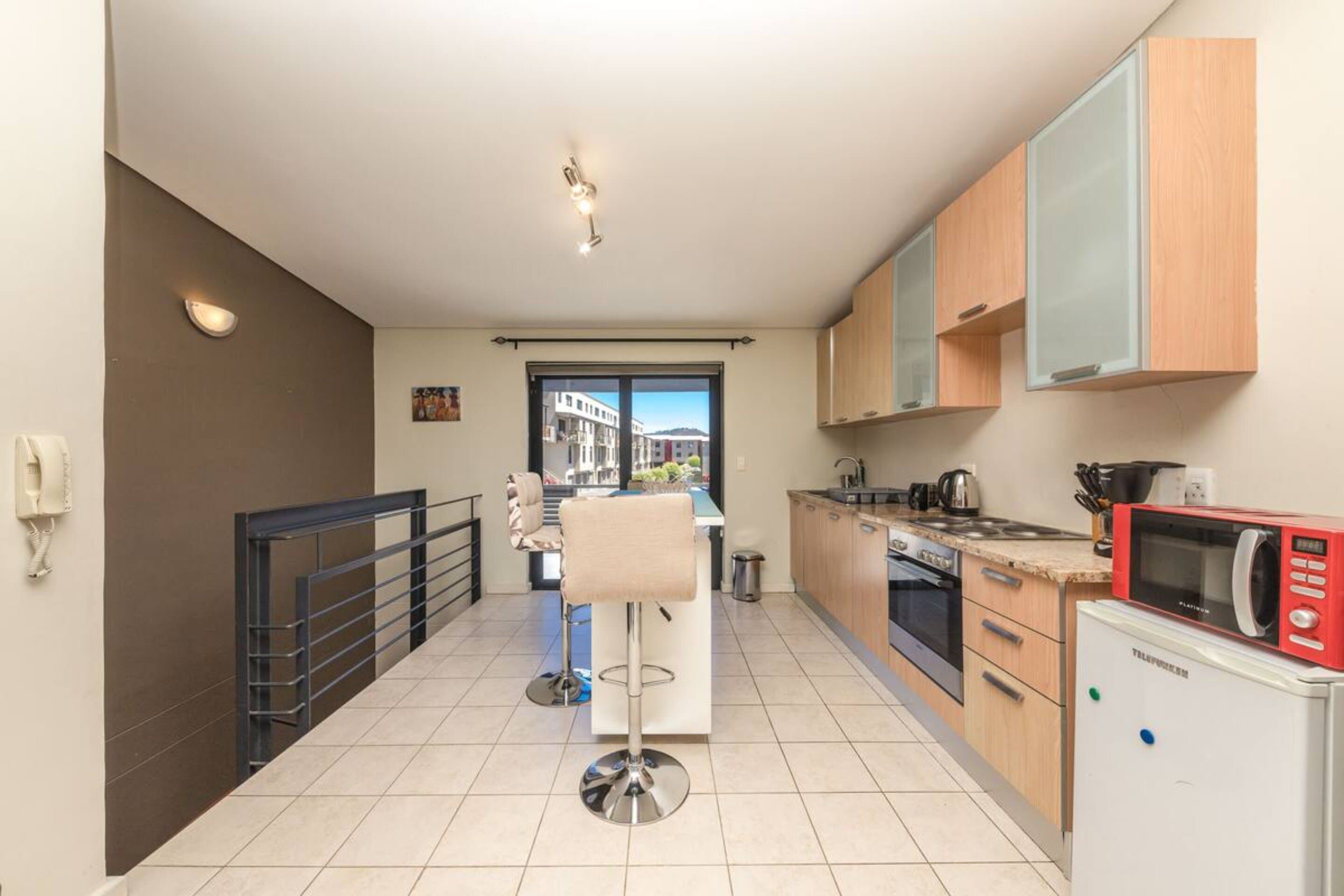 Basic Apartment, Multiple Beds | Private kitchen | Microwave, oven, stovetop, electric kettle