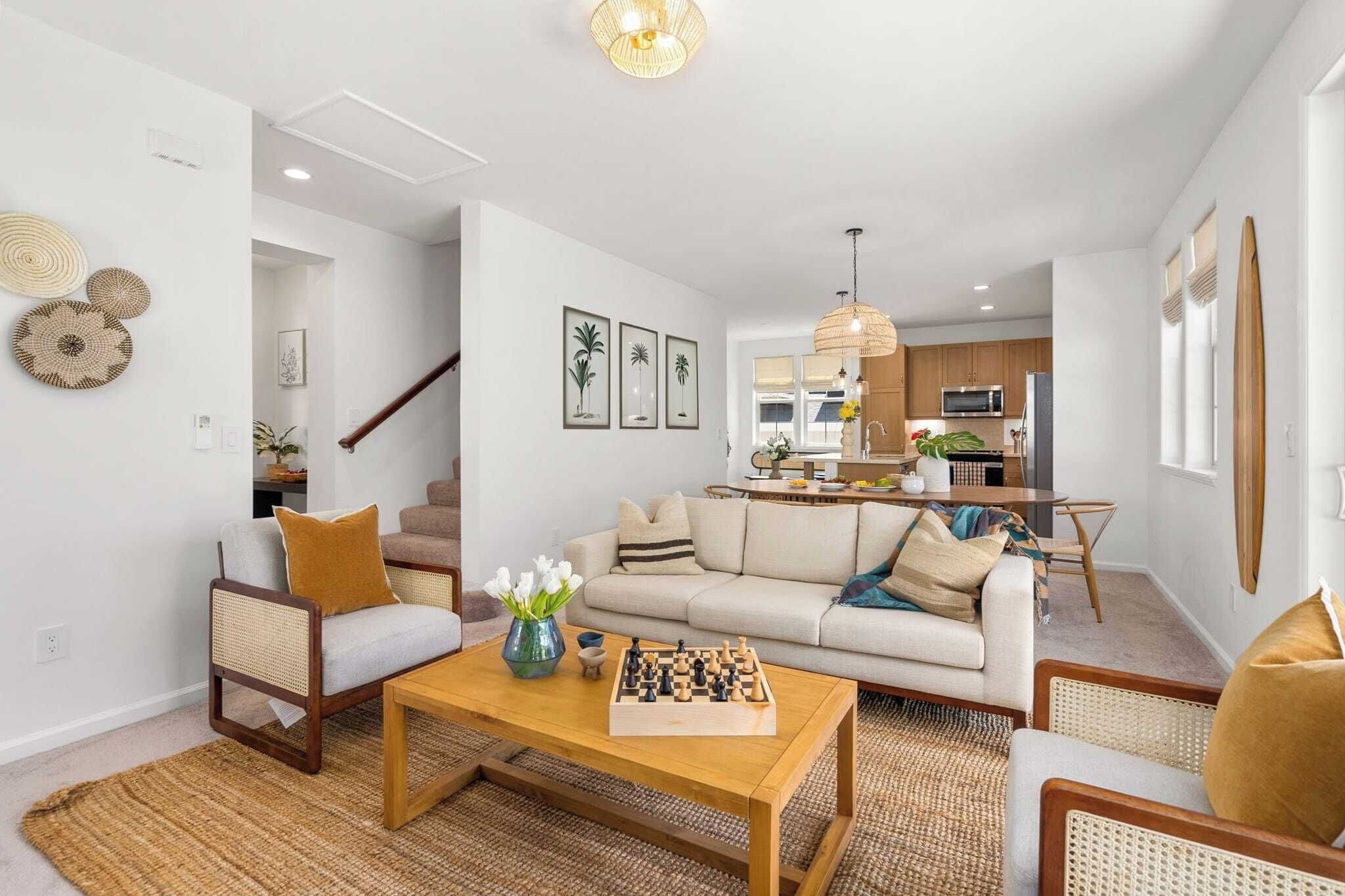 A modern living room with a sofa, coffee table, and a chessboard.
