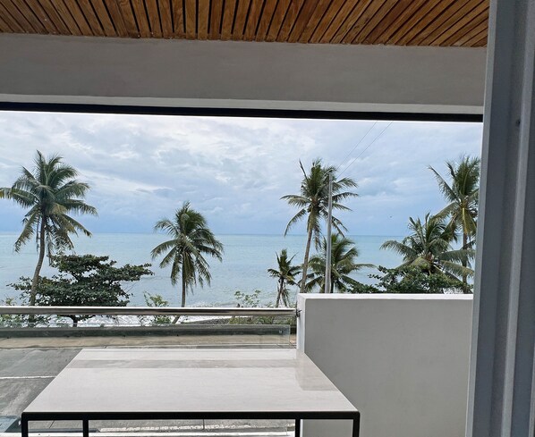 Comfort Quadruple Room, 2 Queen Beds, Ocean View, Oceanfront | Terrace/patio - Happy Island Inn (Virac)