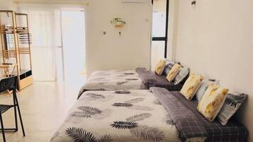 Comfort Quadruple Room, 2 Queen Beds, Ocean View, Oceanfront | Premium bedding, individually decorated, individually furnished, desk