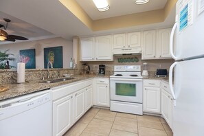 Condo, 2 Bedrooms | Private kitchen | Fridge, oven, coffee/tea maker