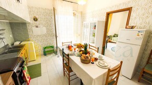 Fridge, microwave, stovetop, cookware/dishes/utensils