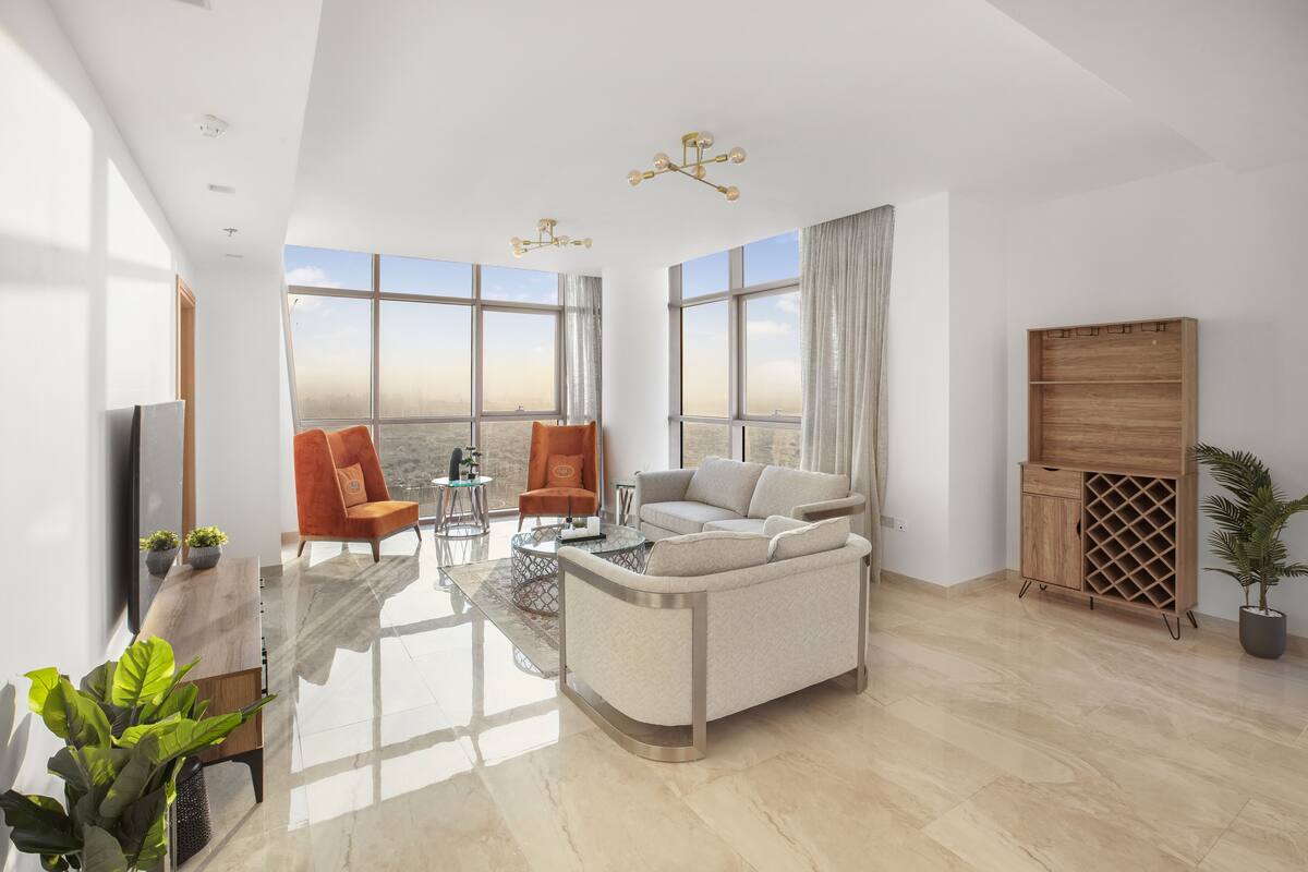 Deluxe Penthouse | Living area | 65-inch Smart TV with cable channels, TV