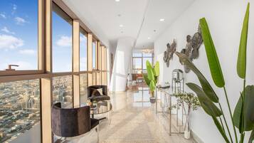 Deluxe Penthouse | Living area | 65-inch Smart TV with cable channels, TV