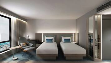 Deluxe kamer, 2 eenpersoonsbedden | Een kluis op de kamer, een bureau, een laptopwerkplek