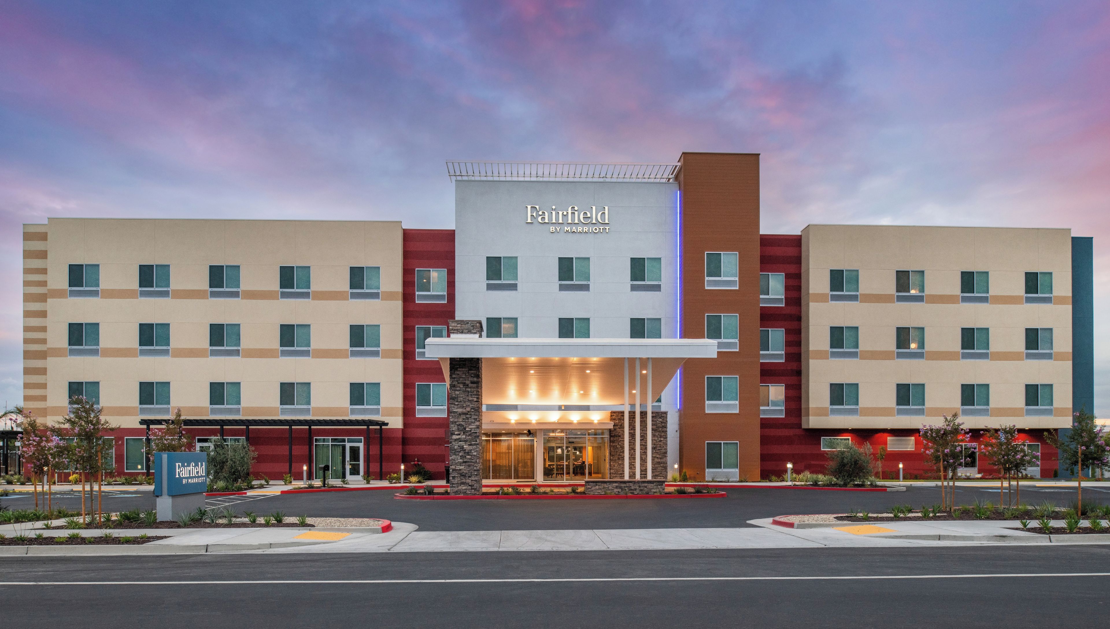 A Fairfield by Marriott hotel with a modern facade, multiple floors, and a prominent entrance.