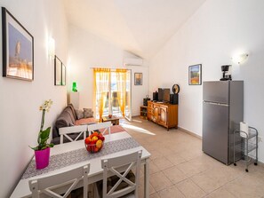 Apartment (One Bedroom Apartment with Balcony an) | Living room | 25-inch flat-screen TV with cable channels, TV - Apartment Irena (Posedarje)