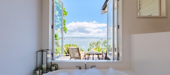 Koi Waiheke - Koi Waiheke is a stunning luxury holiday home in Omiha, Waiheke Island. With 4 bedrooms; 4 bathrooms; a large entertainer’s kitchen; spectacular ocean views; a private mooring; and a boat shed offering direct access to the ocean. This i