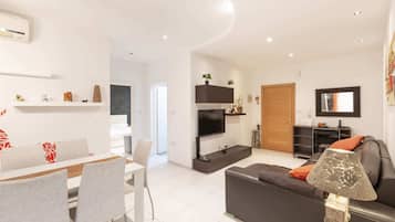 Basic Apartment, 2 Double Beds | Living area | TV