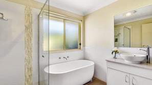 Bathtub, hair dryer, towels