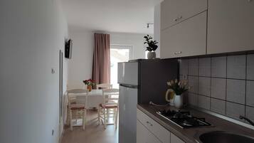 Apartment (Two Bedroom Apartment with Balcony an) | Private kitchen | Fridge, dining tables