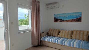 Apartment (Two Bedroom Apartment with Balcony an) | Living room | 25-inch flat-screen TV with satellite channels, TV