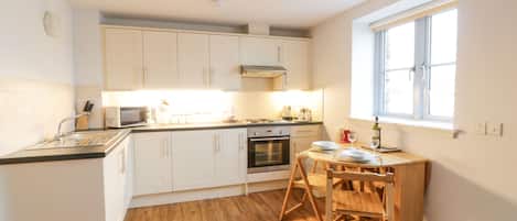 Fridge, electric kettle, toaster, cookware/dishes/utensils