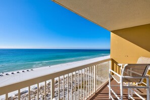A balcony with a view of a beach and ocean. - Pelican Beach 0805 1 Bedroom Condo by Pelican Beach Management (Destin)