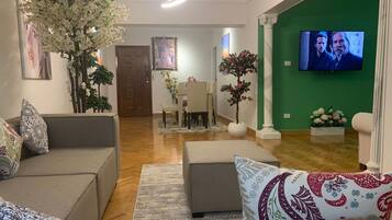 Grand Apartment | Living area | Flat-screen TV