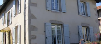 House with fenced garden in village