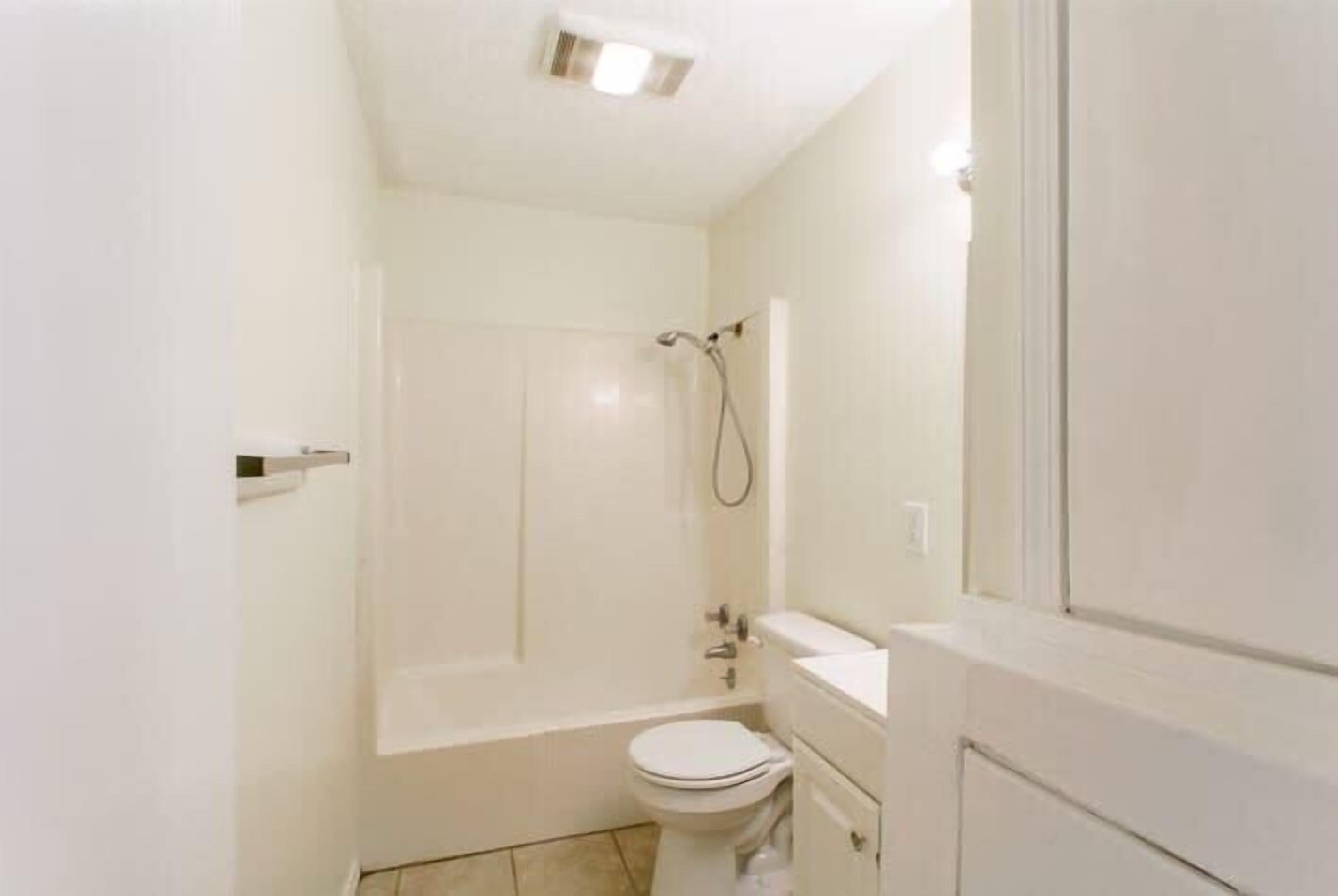 Bathtub, hair dryer, towels