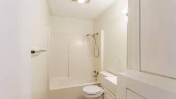 Bathtub, hair dryer, towels