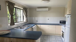 Microwave, dishwasher, dining tables