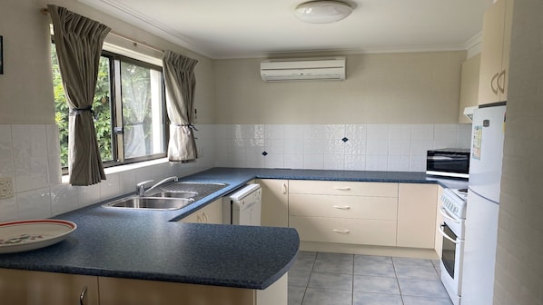 Microwave, dishwasher, dining tables