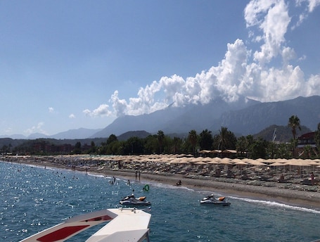 Private beach nearby, black sand, sun-loungers, beach umbrellas