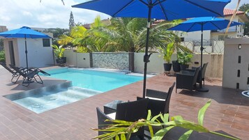 Outdoor pool, open 10:00 AM to 11:00 PM, pool umbrellas