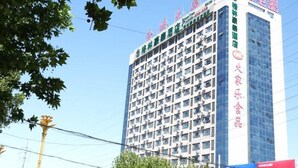 A multi-story hotel building with a modern facade, featuring numerous windows and air conditioning units. - Greentree Alliance Laizhou Bus Station Wenhua West Street (Yantai)