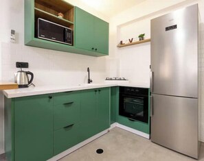 Fridge, stovetop, dining tables
