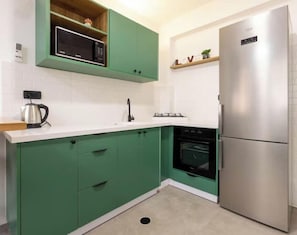 Fridge, stovetop, dining tables