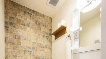 Bathtub, hair dryer, towels