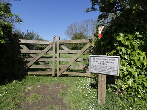A wooden gate with a sign for Crantock Trust Garden. - Lavender House (Newquay)