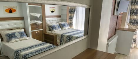 Desk, laptop workspace, free WiFi, bed sheets