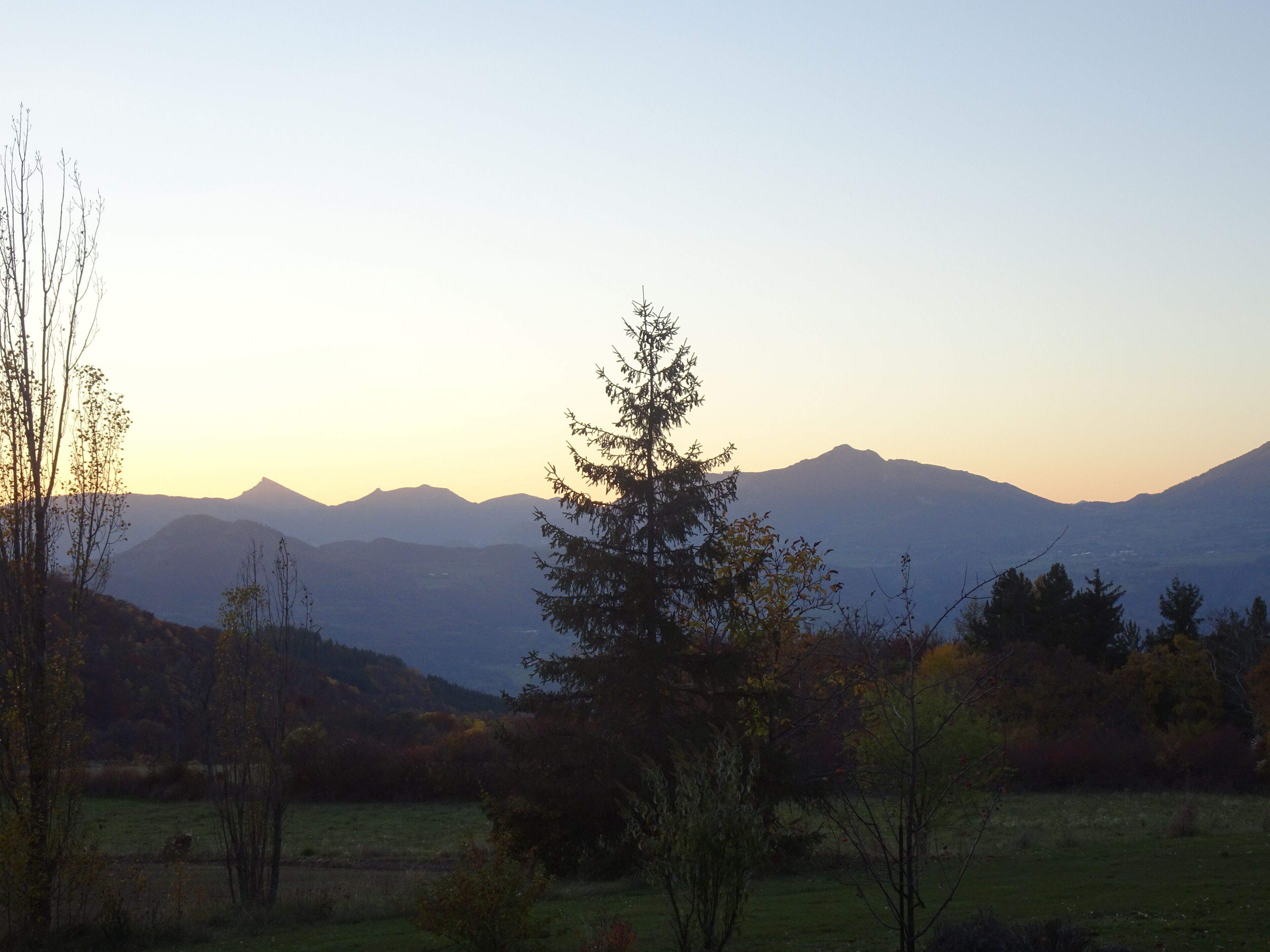 A mountain landscape with a clear sky.