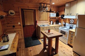 Fridge, microwave, oven, stovetop - Forest Cabin #1 at Camp Because I Said I Would (Walhonding)