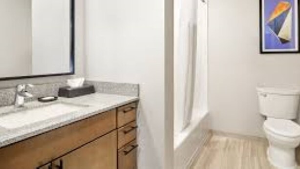 A bathroom with a sink, mirror, and toilet. - Worldmark Moab 3 Bedroom Condo (Moab)