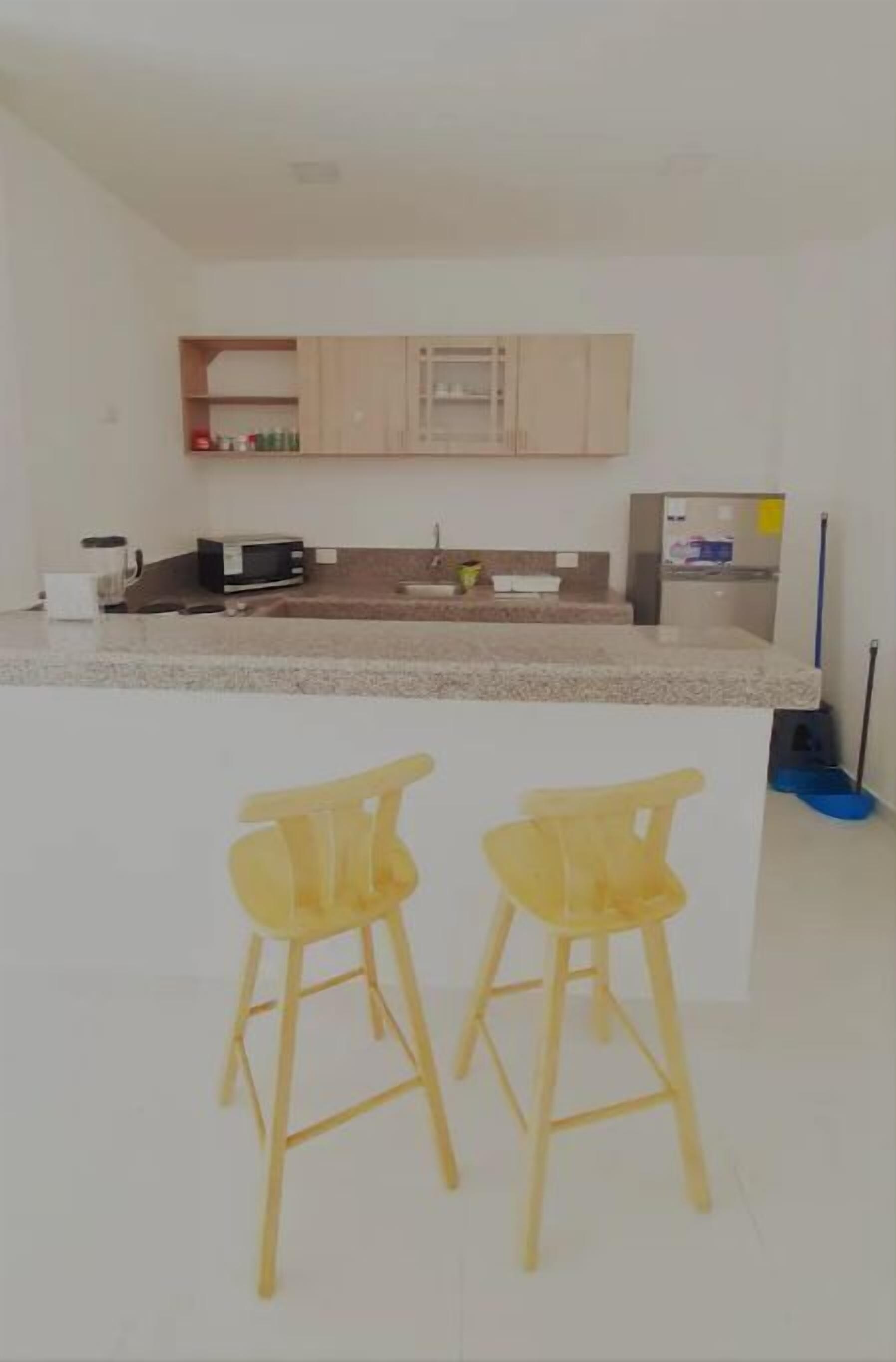 Fridge, blender, cookware/dishes/utensils, dining tables