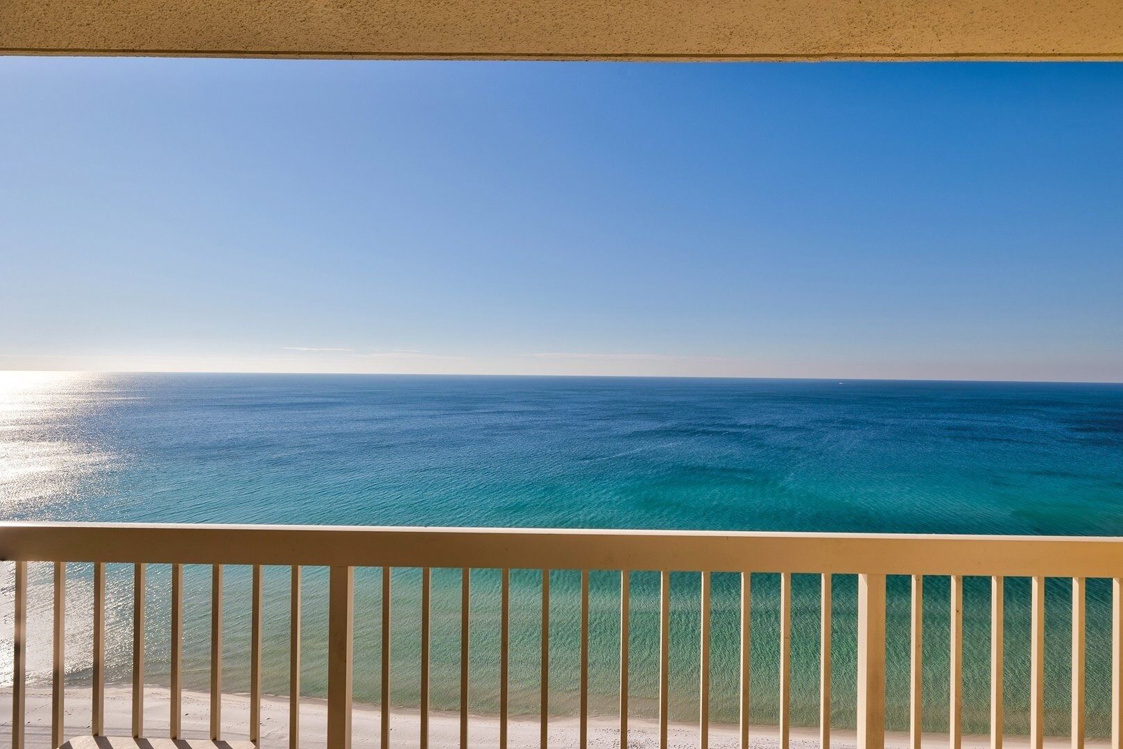 A balcony with a view of the ocean.