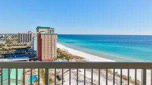 A beachfront hotel with a pool, beach access, and ocean views. - Pelican Beach 1816 2 Bedroom Condo by Pelican Beach Management (Destin)