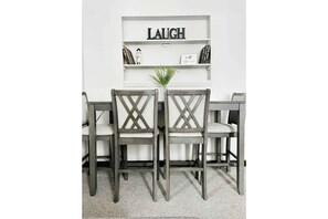Enjoy meals in a stylish dining area with a shelf, table, and four chairs.