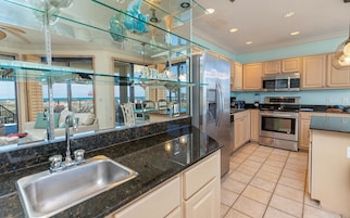 Condo, 3 Bedrooms | Private kitchen | Fridge, oven, coffee/tea maker, dining tables